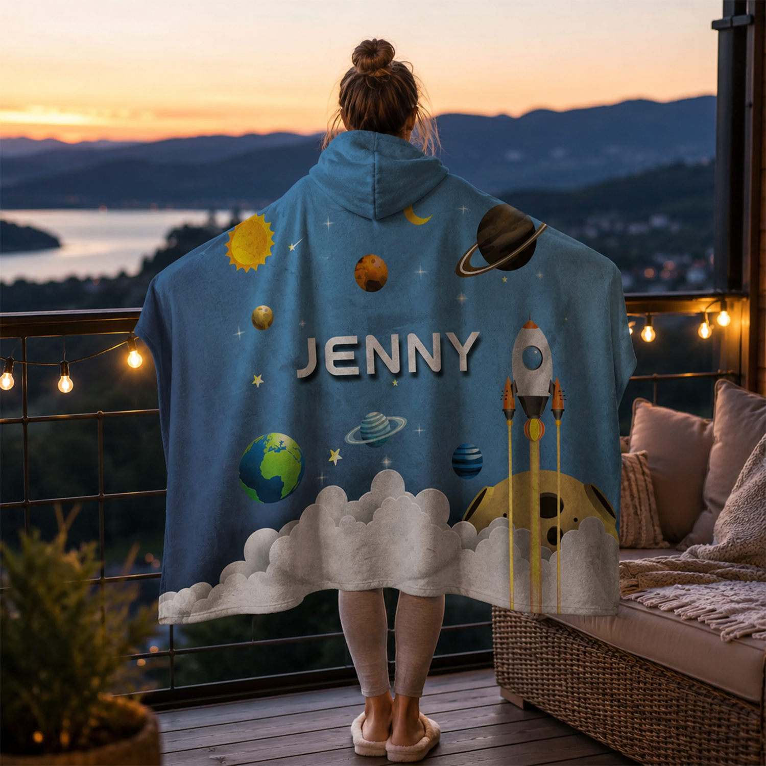 Child wearing personalized galaxy spaceship hooded blanket as space themed gift
