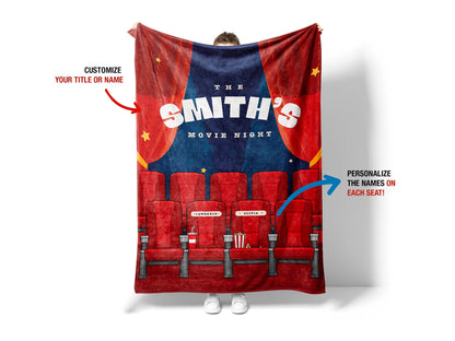 A person holding A cozy throw blanket featuring a playful movie night theme, adorned with images of popcorn, film reels, and a remote control,