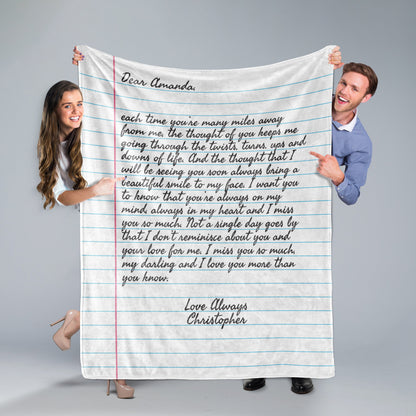 A man and a woman holding a Custom Letter Note Throw Blanket Ruled Paper on grey background