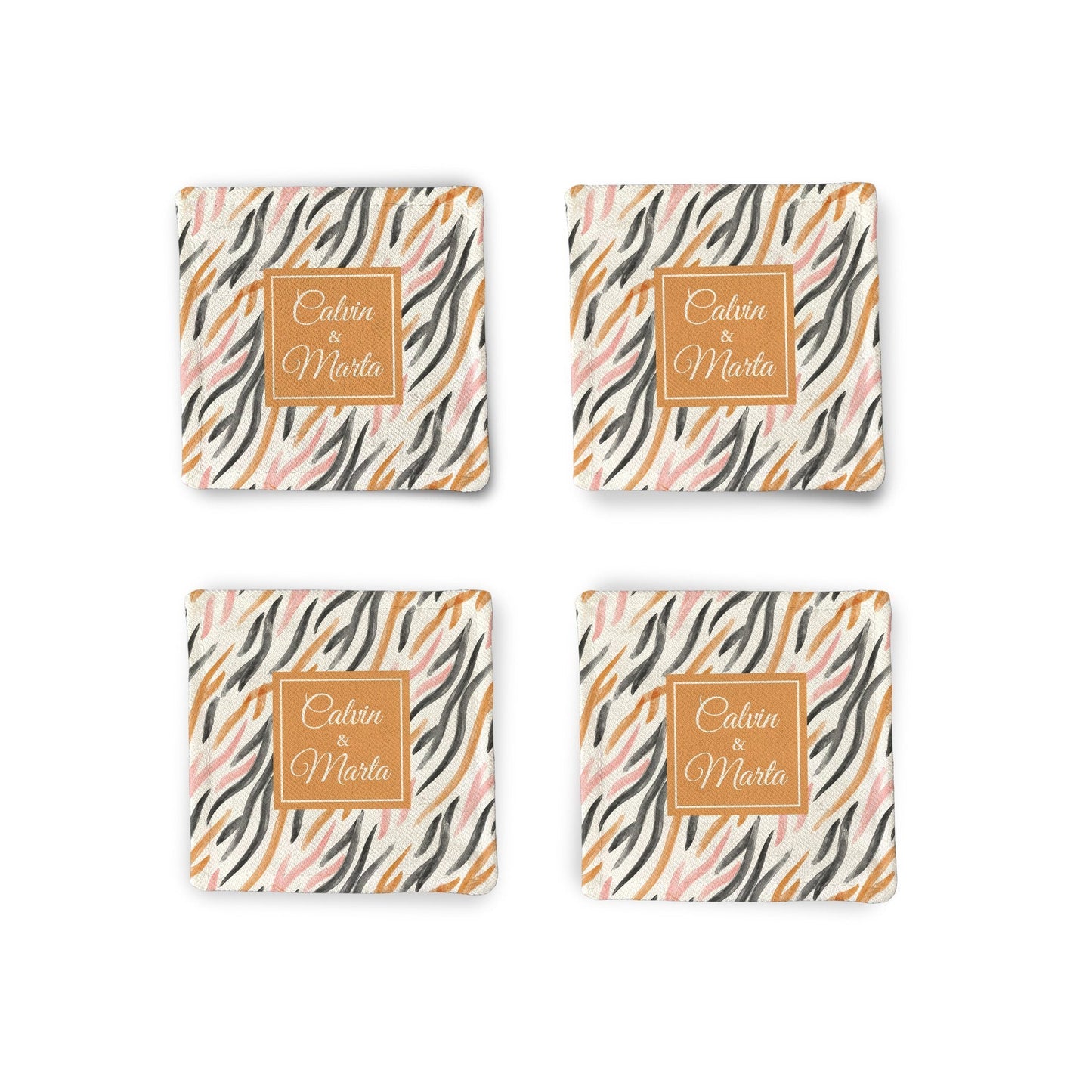 A set of 4 Personalized Orange watercolor Fabric Coasters on a white surface