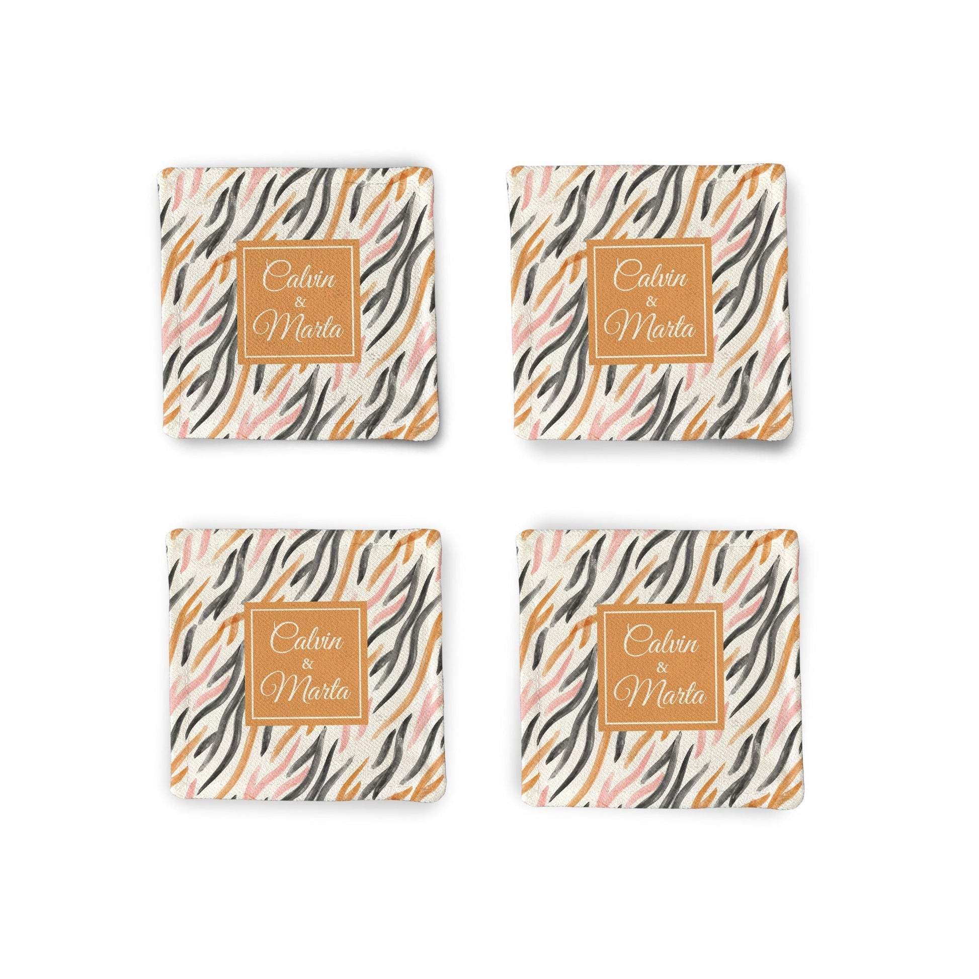 A set of 4 Personalized Orange watercolor Fabric Coasters on a white surface