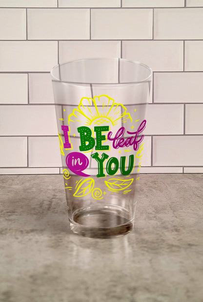 I Be-Leaf In you Tunbler Glass against a slipslap wall