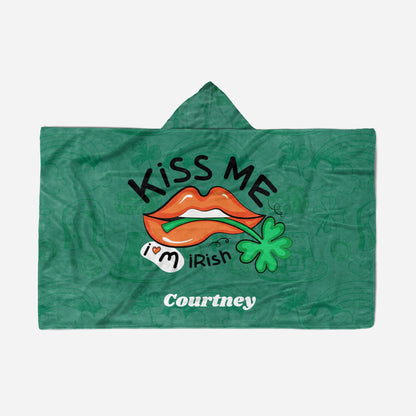 Green hooded blanket with "Kiss Me I'm Irish," orange lips, a shamrock, and the name "Courtney" at the bottom.