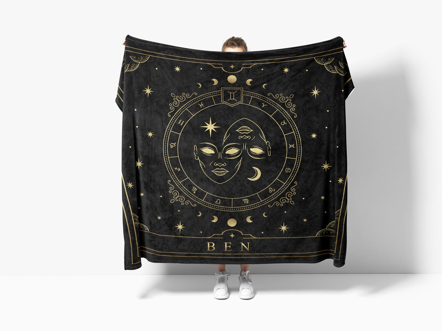 A black throw sherpa blanket with Gemini Zodiac sign and customized name with a white background