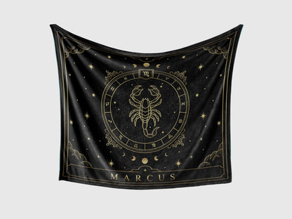 A black throw fleece blanket with scorpio Zodiac sign and customized name with a white background