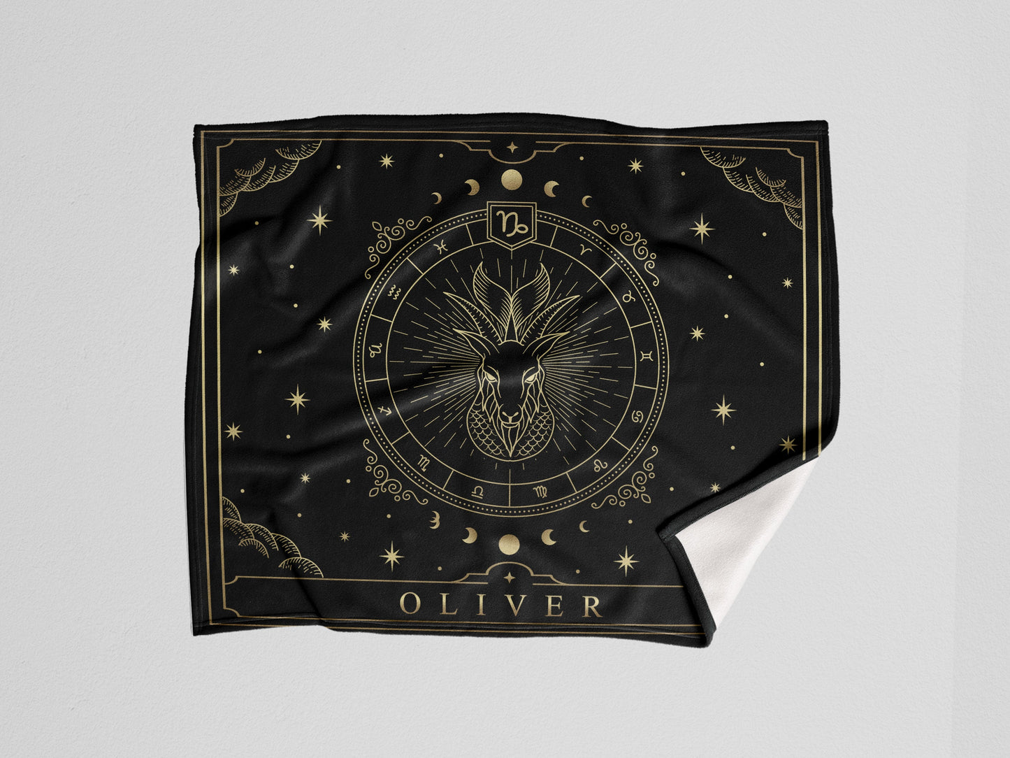 A black throw sherpa blanket with capricorn Zodiac sign and customized name with a white background