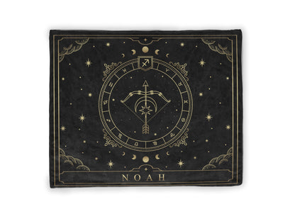 A black throw fleece blanket with sagittarius Zodiac sign and customized name with a white background