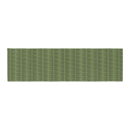 A Green Tribal Table Runner displayed flat on a white surface